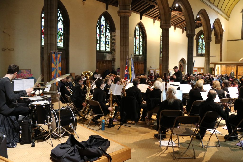 The band performing in a church.